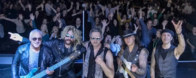Always Bon Jovi tribute band performing live on stage in Sydney under concert lighting.